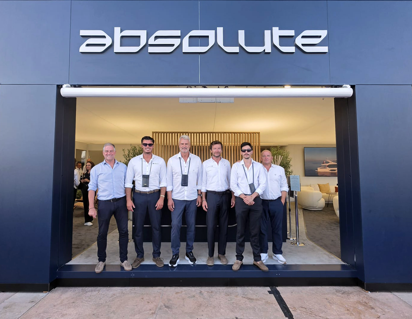 The ABS Marine Sales team in front of an Absolute showroom